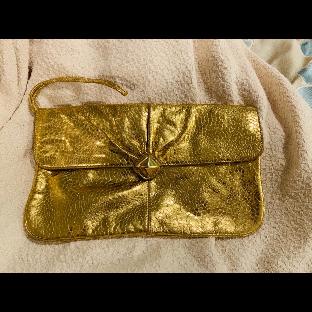 Gold clutch with wrist attachment